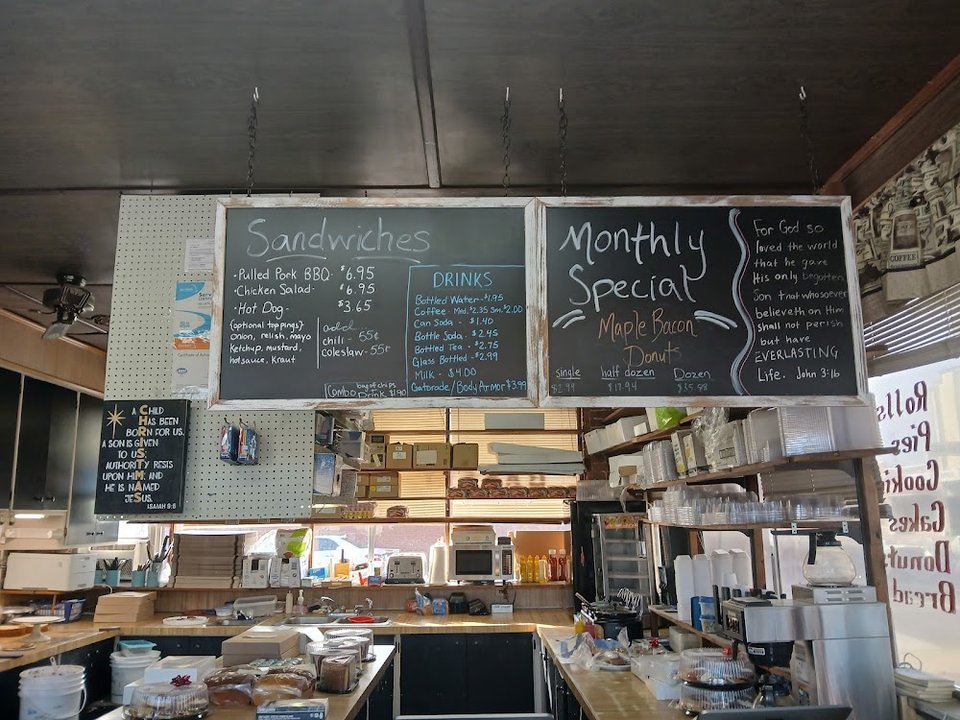 Printed menu with sandwiches and drinks.
